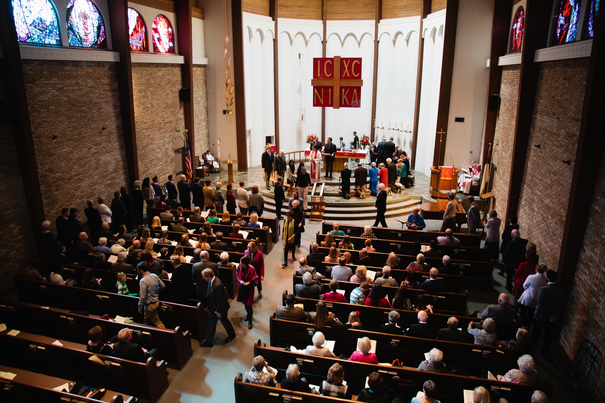 Congregation gathered for worship in the sanctuary, viewed from the balcony.